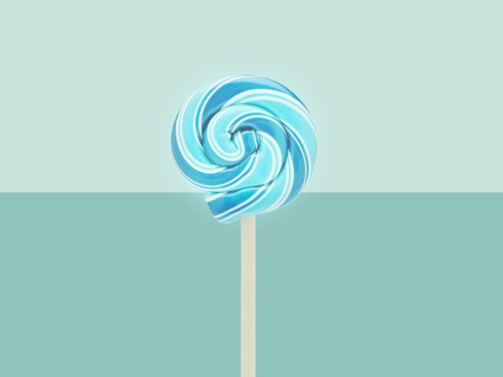 blue lollipop on a greenish background